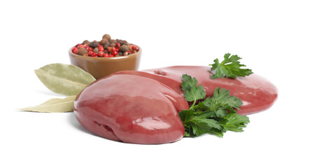 Fresh raw pork kidney with parsley, bay leaves and peppercorns on white background