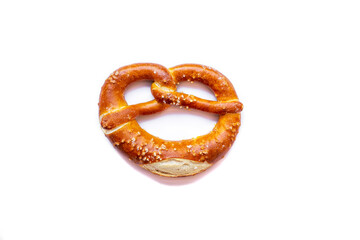 Freshly baked pretzel close-up, isolated on a white background