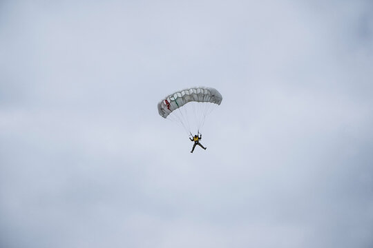 Person Parasailing In The Sky