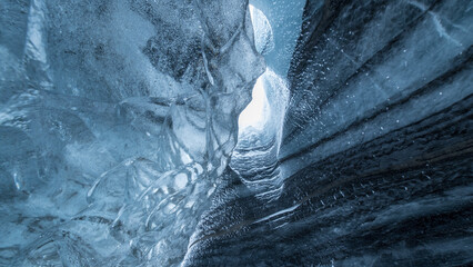 Inside view of large ice boulder in a cave in Iceland