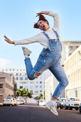 I was not made to be subtle. Shot of a playful young woman out in the city during the day.