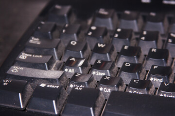 Closeup detail of a dirty plastic black keyboard
