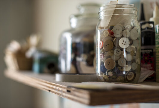 Closeup of a jar of buttons
