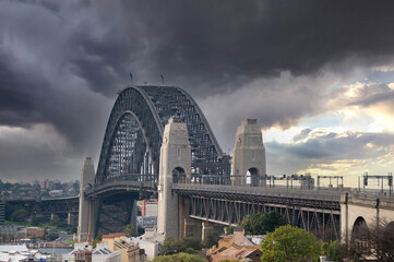 Breathtaking view of Sydney Harbour Bridge against a dark clouds, Sydney, Australia - obrazy, fototapety, plakaty