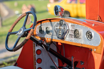 View of a vintage car's dashboard in sunlight