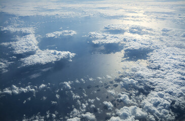 Aerial shot of the sea covered with white clouds
