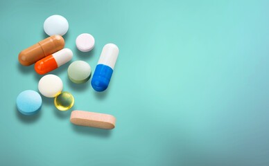Antibiotic capsule pills on background. Prescription drugs. Colorful capsule pills.