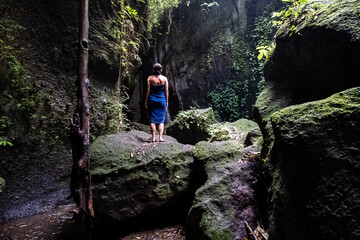 Beautiful shot of a female relaxing in a cave in Bali, Indonesia