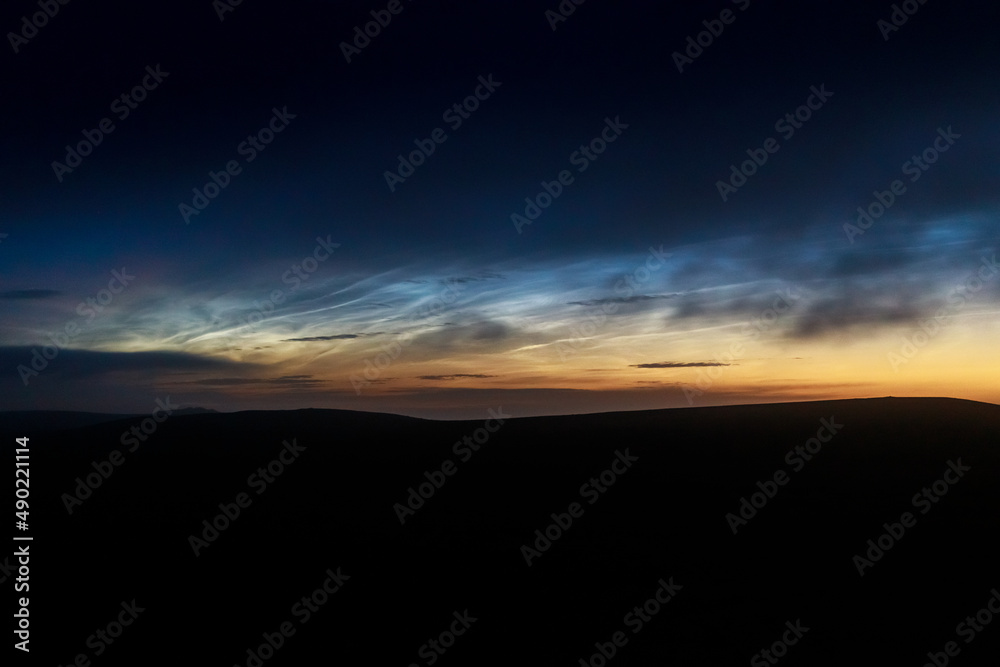 Poster Beautiful night shot of Noctilucent blue Clouds