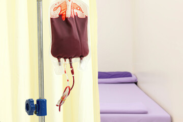 A bag of blood on a metal stand.   Blood transfusion and blood donation concept.