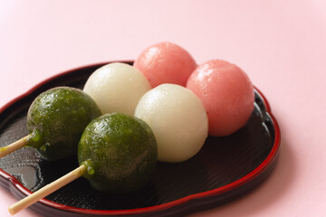 Japanese sweets. Close-up of three-color dumplings.  和菓子。3色団子のクローズアップ