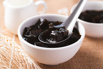 Grass jelly or herb jelly, dessert in Southeast Asia made from plant eating with syrup, bubble tea or other drinks