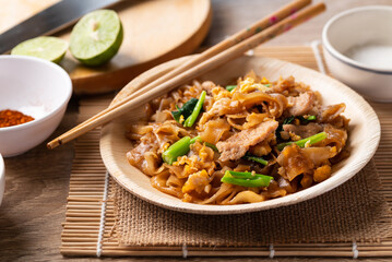 Thai food (Pad See Ew), Stir fried rice noodles with soy sauce, egg, kale and pork