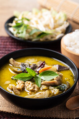 Thai food, Green curry chicken eating with rice noodles and fresh vegetables