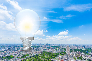 都市風景と電球のエネルギーイメージ　Energy image of Tokyo cityscape
