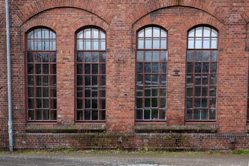 Exterior of a building with red brick walls and windows