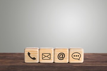 Customer support hotline. Contact us concept. Cube wood with the email, call phone, address