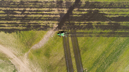 Beautiful view of pumping cow manure into fields - obrazy, fototapety, plakaty