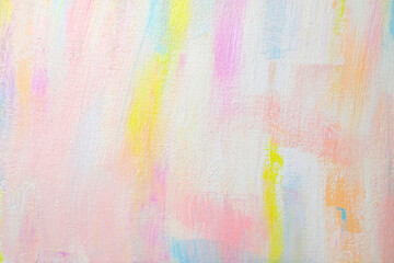 Strokes of different pastel acrylic paints on white canvas, closeup