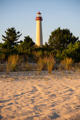 Vertical shot of the sandy beach and Cape May Lighthouse in Lower Township, New Jersey