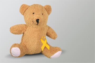 International Childhood Cancer Awareness month, Children toy with golden Ribbon for supporting