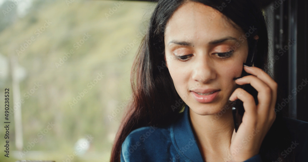 Poster Closeup shot of a South Asian female talking on the phone