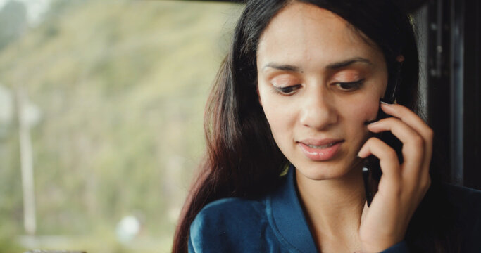 Closeup Shot Of A South Asian Female Talking On The Phone