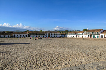 Panorama of the wide open Plaza Mayor of Villa de Leyva on a sunny day, Colombia
