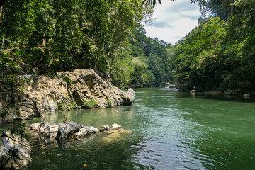 Idyllic view to Rio Claro canyon with lush green vegetation and rocks, Doradal, Colombia
