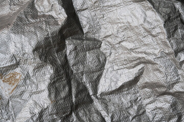 Silver tarp dirty and wrinkled texture background