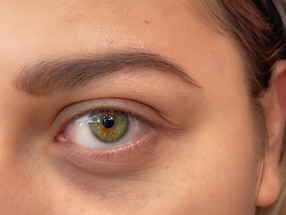closeup of a beautiful intense yellow eye. yellow woman eye