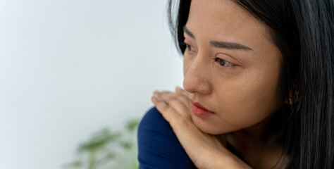 Depression and mental illness. Asian woman disappointed, sad after receiving bad news. Stressed girl confused with unhappy problems, arguing with boyfriend, cry and worry about unexpected pregnancy.