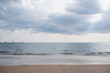 Landscape image of tropical white beach with blue sea and sky background