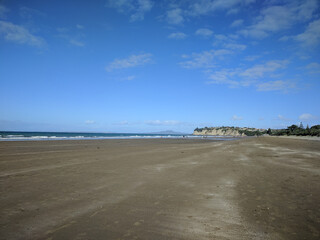 Long Bay beach, sea and Rangitoto island on background, New Zealand.