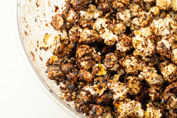 Chocolate caramel popcorn on a solid background