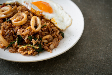 fried rice with squid and basil topped fried egg in Thai style