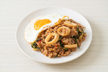 fried rice with squid and basil topped fried egg in Thai style