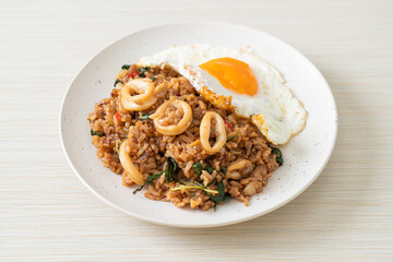 fried rice with squid and basil topped fried egg in Thai style