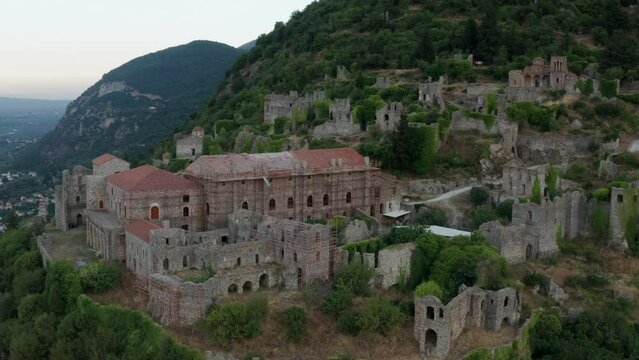 Byzantine Archaeological Site Of Mystras In Peloponnese, Greece - View of the remains of buildings - aerial drone shot