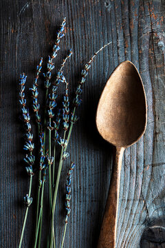 wooden spoon with lavender on wooden background