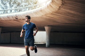 Hold on to all the determination you have. Shot of a sporty young man exercising outdoors.