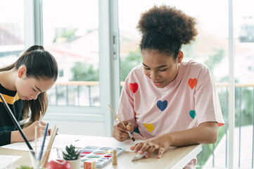 Students girl learning art in the classroom with friend