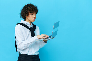 student with laptop internet in a white shirt with a sweater cropped view