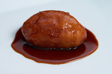 Nuegado el salvador pastry dipped in sweet caramel	