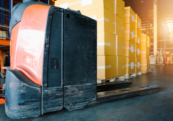 Electric Forklift Pallet Jack with Packaging Boxes in Storage Warehouse. Cargo Shipment Goods Boxes. Supply Chain. Shipping Warehouse Cargo Import - Export.	