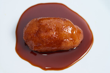 Nuegado el salvador pastry dipped in sweet caramel	