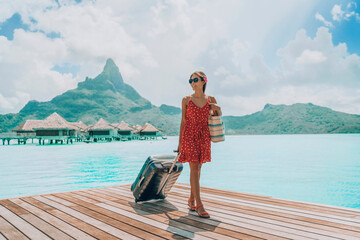 Luxury Bora Bora travel vacation cruise ship passenger tourist arriving at port of call harbour in Bora Bora island, Tahiti, French Polynesia with luggages. Woman on paradise getaway beach hotel. - obrazy, fototapety, plakaty