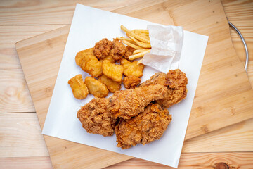 Fried chicken Crispy Chicken on white , Fried chicken set with nuggets, french fries on wooden background..