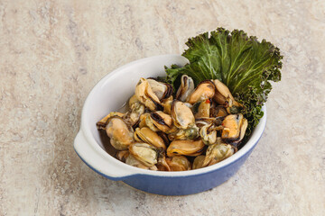 Tasty marinated mussels in the bowl