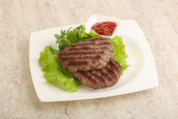 Grilled beef burger cutlet with sauce